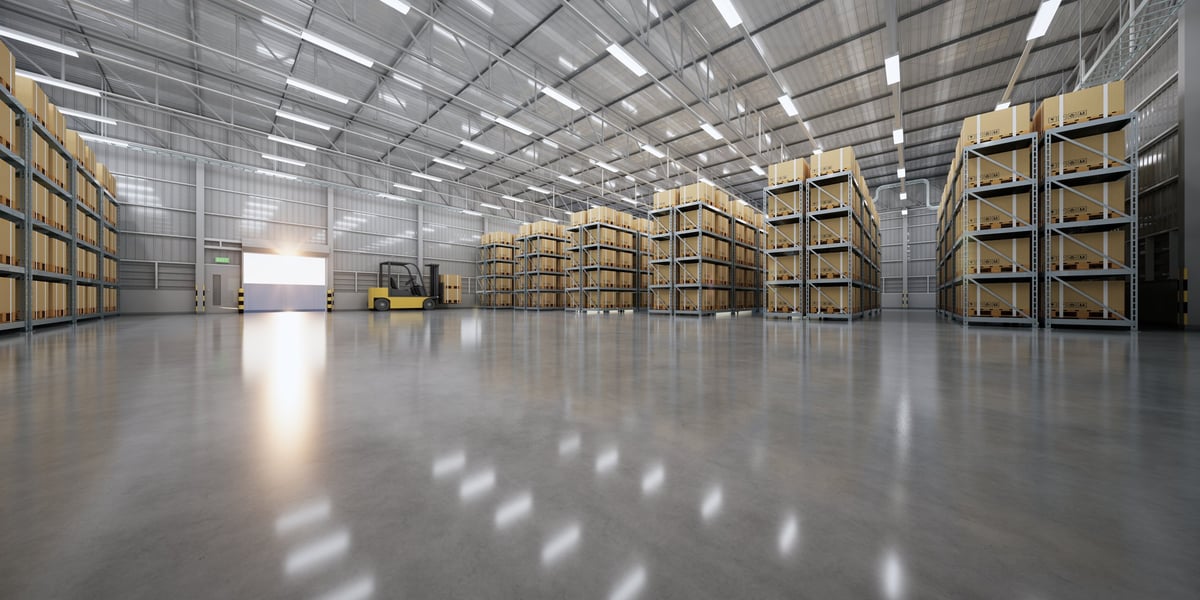 Warehouse interior with organized stacks of cardboard boxes